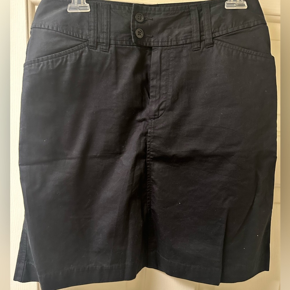 Black, fly button and zipper skirt by GAP. Versatile. Casual or business.